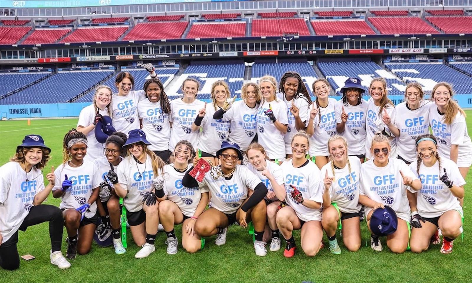 The girls' flag football team celebrates their tournament win